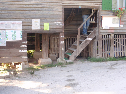 Ferry House, note the flood line markers for different years.